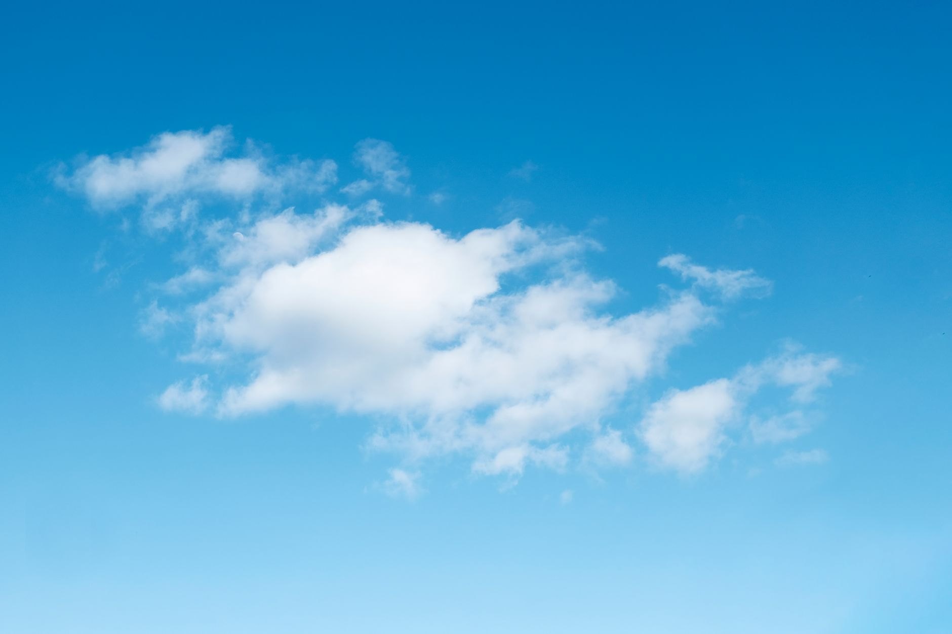 fluffy white cloud in the blue sky